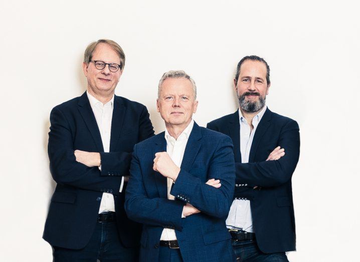 The three founders of NextWind standing next to each other with arms folded across their chest.